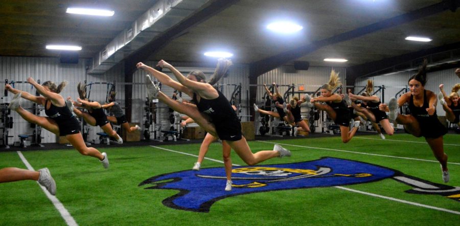 Jumping for joy... Cheerleaders condition for the Southern Super Regional competition.  Photo by Madison Hamlin.