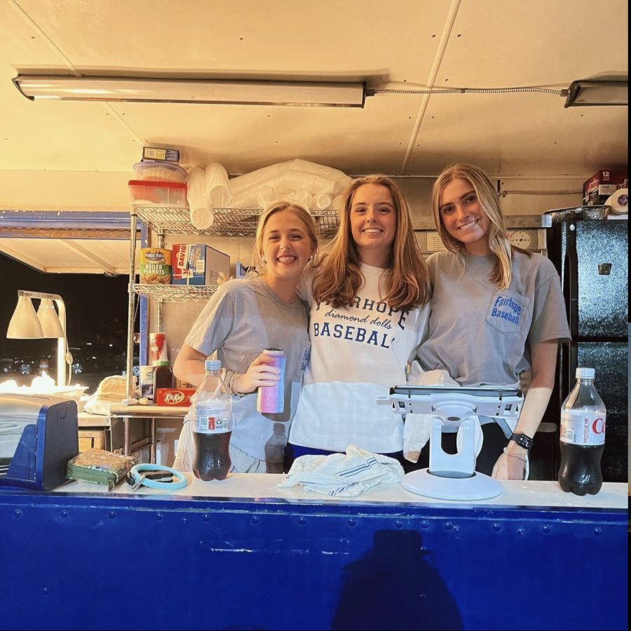 Good game, greater food... Diamond Dolls Ainsley Daniel, Ella McDowell and Sarah Lu Priester serve concessions during an evening game. 