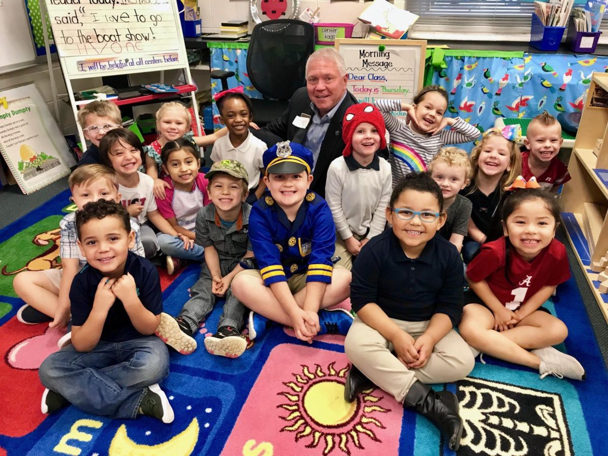 For the kids... Superintendent Eddie Tyler sits with joyful, young Baldwin County students. He and his accomplishments are producing some wonderful students in Baldwin County. 

Photo courtesy of the Mulletwrapper website