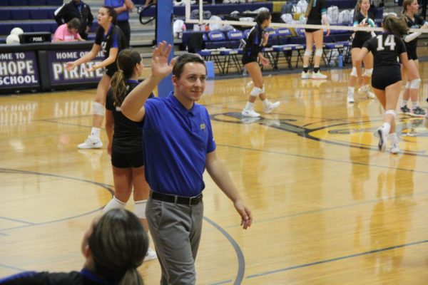 Show Appreciation... Coach Kalmar waves to the student section. Kalmar prepared the Lady Pirates to play the Lady Dolphins. Thank you all for supporting, and coming,” Kalmar said.