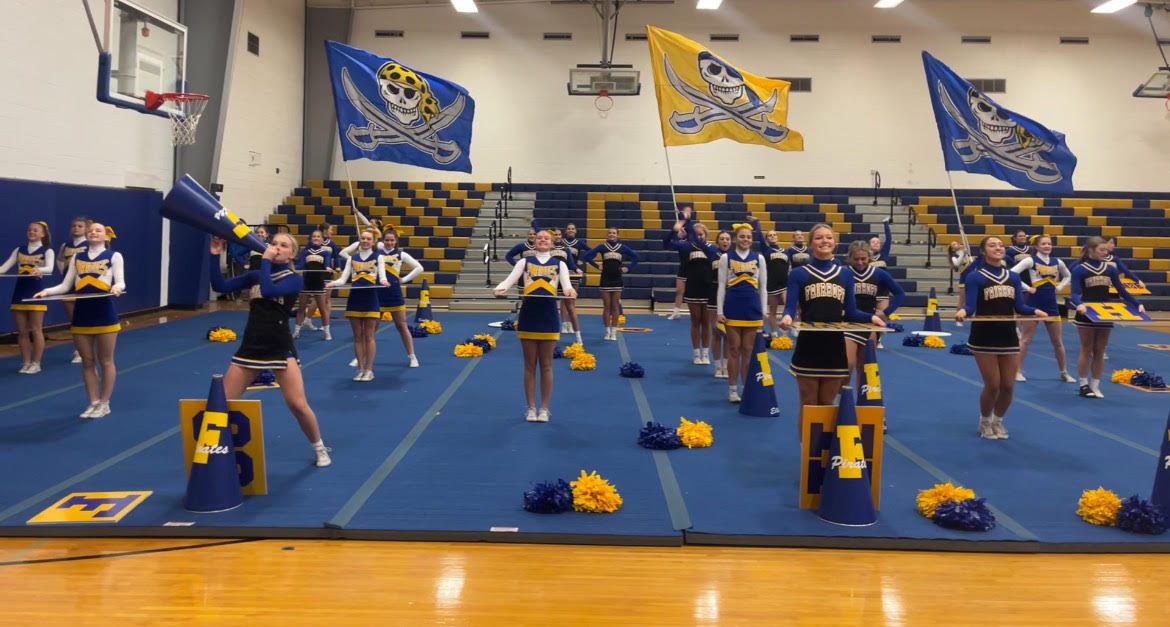 Go blue gold... Lady Pirates perform their cheer routine for the crowd.Theyre set 
to compete in December.