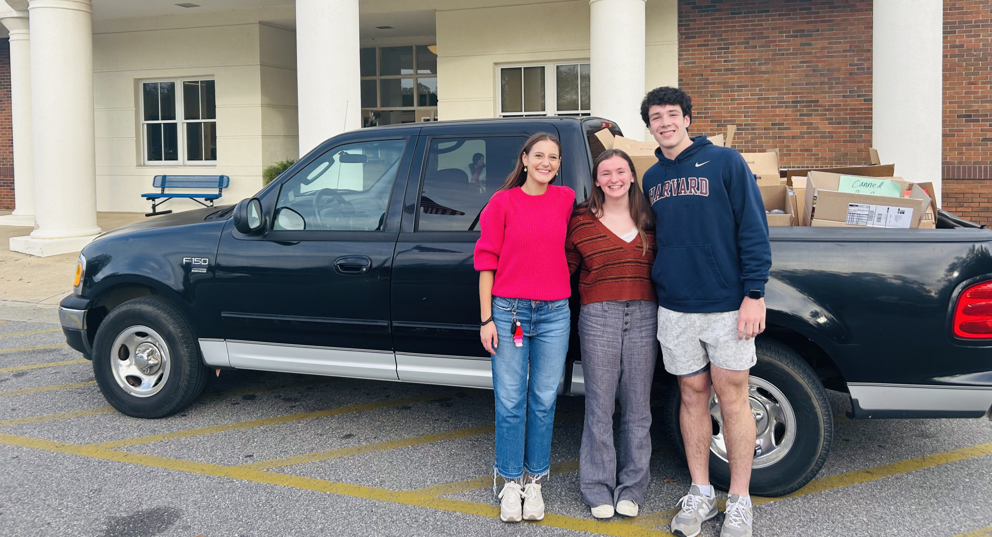 On a roll… SGA representatives Anna Bowler Conyers, A.C. Ahrendt and Sanders Daniell prepare to deliver cans to Prodisee Pantry. Seniors spent all morning collecting cans.