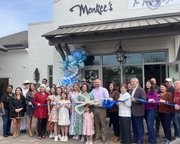 Best day ever….. Monkee’s owner Holly Saliski cuts the ribbon to celebrate the Grand opening of her new boutique. Friends, staff and family surrounded her to celebrate the exciting occasion.