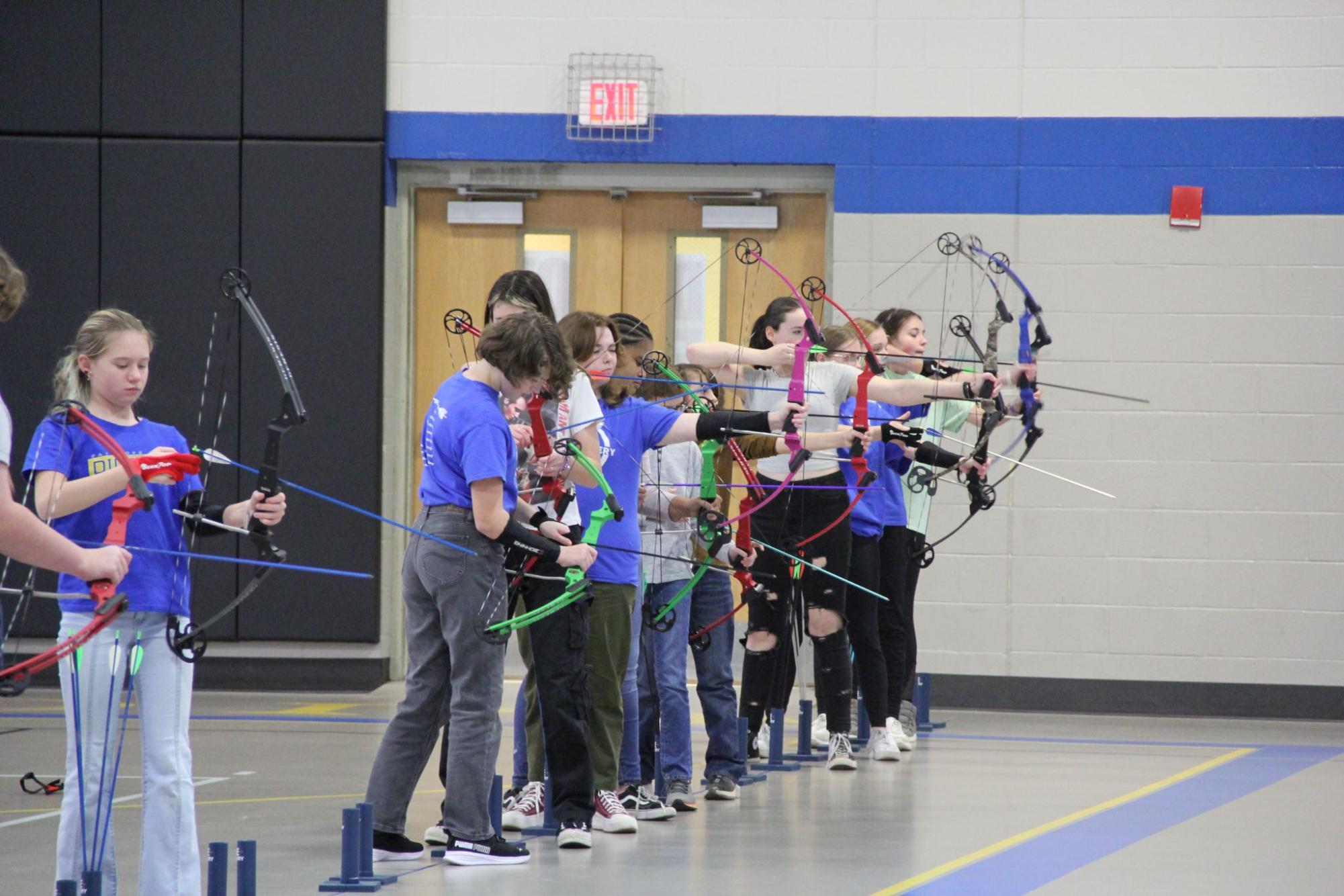Lining up… Fairhope Archers prepare to shoot from the 10 meter line. The 
supervisor blew the whistle, and archers walked to collect scores.