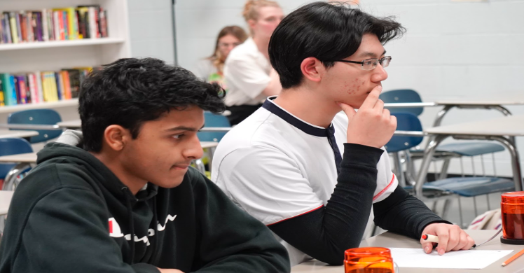 Game face on….. Students pay attention to their selected subject trivia questions in Scholars Bowl practice. They concentrated intensely as they practiced.