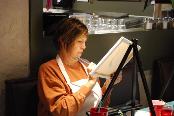 Gleaming light… Kristy Lee enjoys her time painting and eating at Nini Squares. She wanted to try something new in her life.