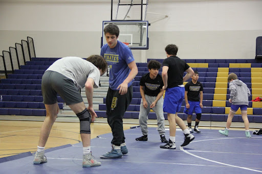 Warming up… Justin Carlson warms up with his teammates. They prepared for their match.