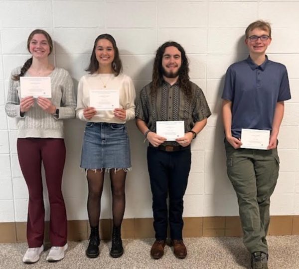 Accepting Awards… Lena Amare, Addison Spears, Gavin Laxton and Noah Sugg accept their reward as finalists for the National Merit Scholarship Program. 