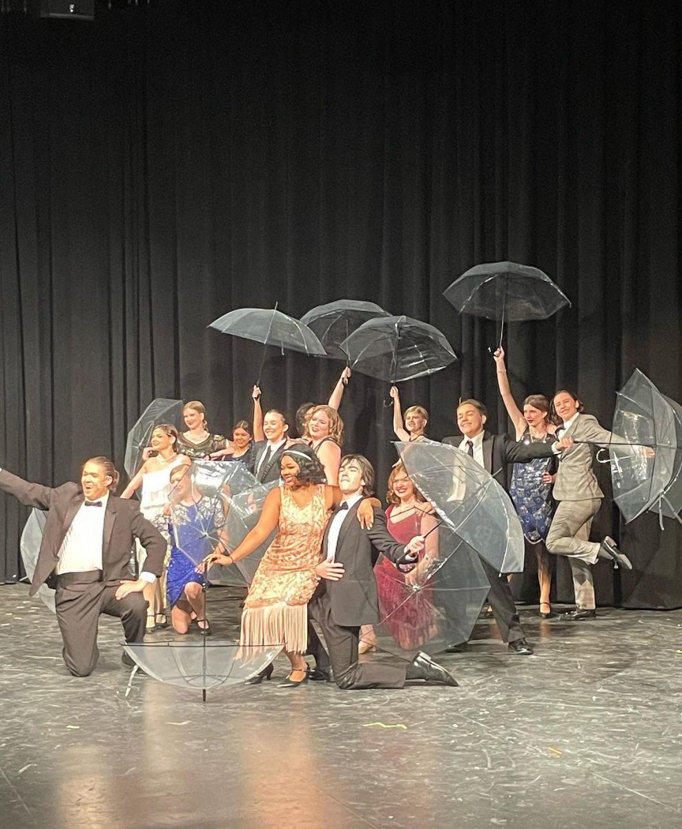 Take a bow… Drama Club students perform their final number in “Singing in the Rain.” This spring show featured singing, dancing and acting. Photo courtesy of Fairhope High Instagram.