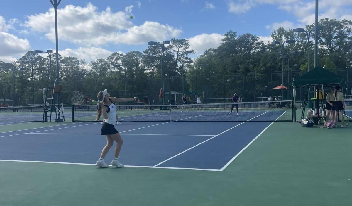 Doubles defeat… Seniors Skylar Spinks and Paige Evans compete in doubles against Mary Montgomery players Halle Stringfellow and Makalya Powell. Spinks served the ball and ended the match with a score of 6-0, 6-1.