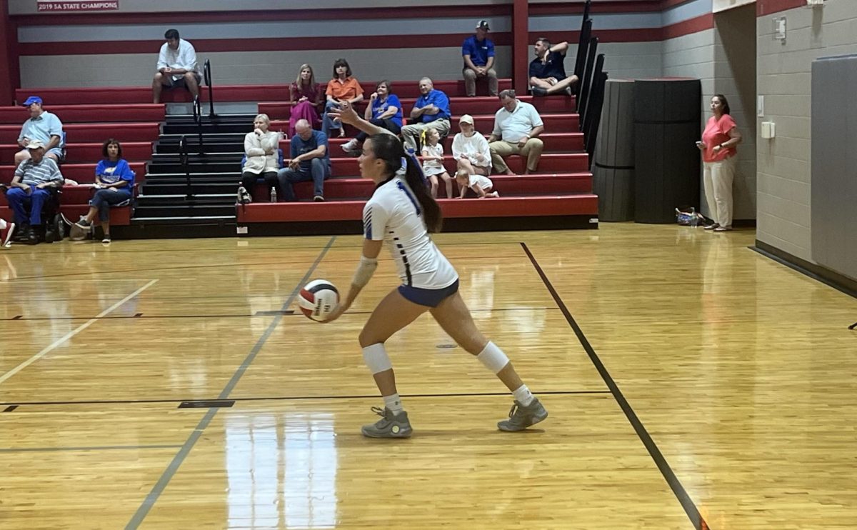 Pirate power… Senior outside hitter Brooklyn Ewart prepares her jump serve. She served the ball over the net and secured an ace for her team.