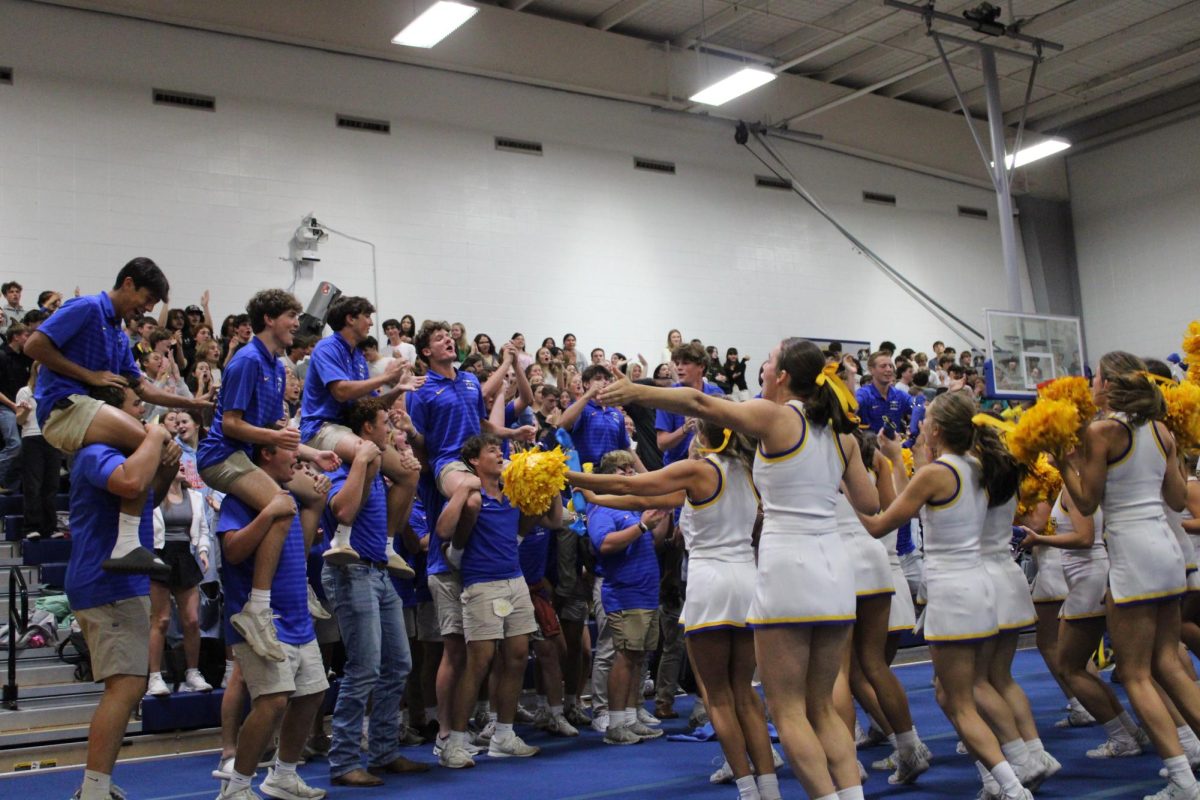 Rock With The Gold… Junior football players cheer with the varsity cheerleading squad in preparation for the football game Friday, October 4, at the Spina Bifida pep rally. Brett Horne, football coach, spoke to attendees about the importance and impact of the theme of this pep rally and game. 