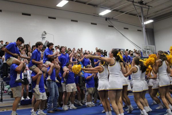 Rock With The Gold… Junior football players cheer with the varsity cheerleading squad in preparation for the football game Friday, October 4, at the Spina Bifida pep rally. Brett Horne, football coach, spoke to attendees about the importance and impact of the theme of this pep rally and game. 