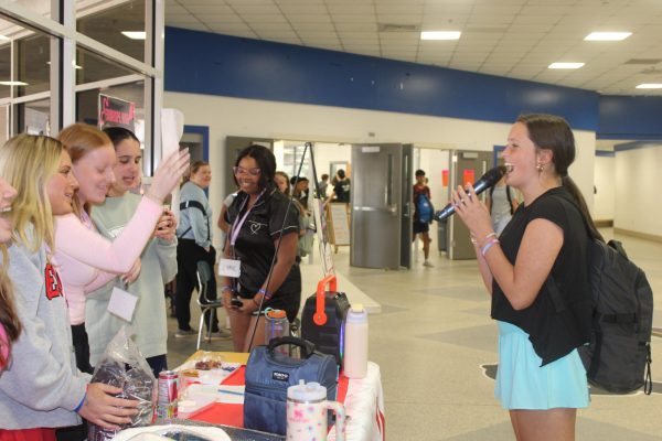 Singing stars… Students participate in karaoke during lunch waves to help the Peer Helpers raise awareness during Red Ribbon Week. Students received little ribbons and bracelets for their participation. 