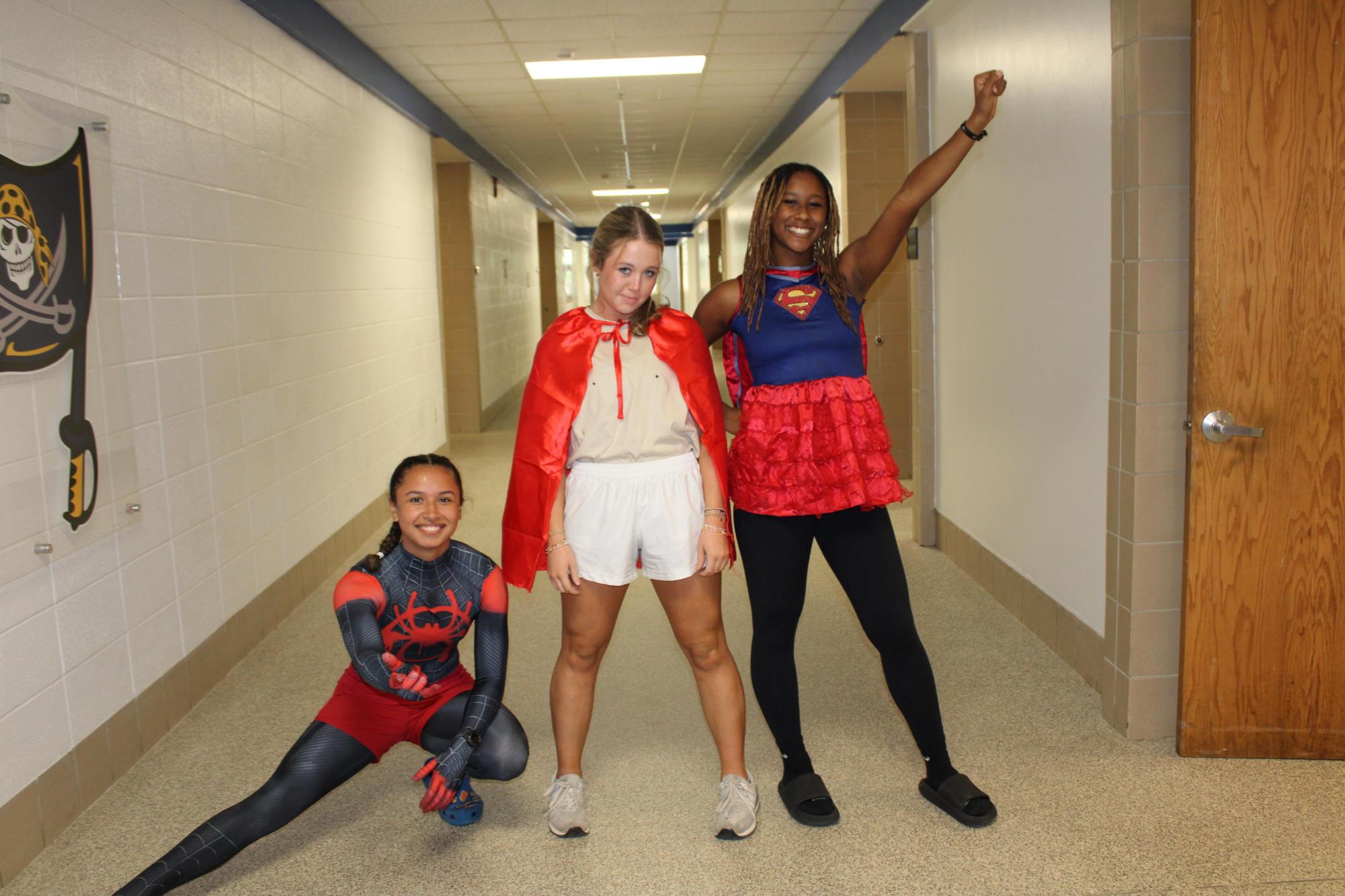 To the rescue!… On the first day of Homecoming Dress up week, September 23, students Lillian Moreno, Bradyn Bauguss and Aubrey Warner prepare to save the day with the theme Superhero. The annual event the week before Homecoming gave students and faculty alike the opportunity to express creativity with fun themed outfits and props.