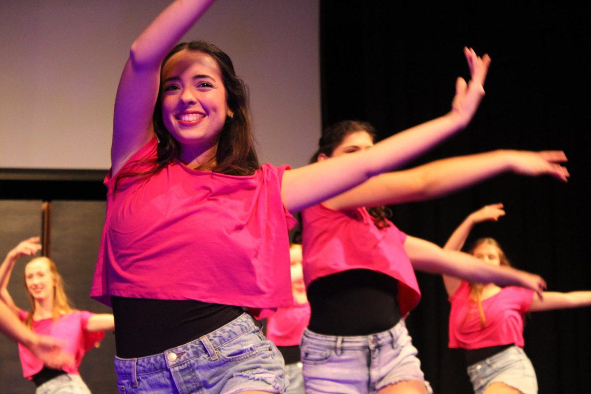 In beat… Senior dancer Karlee Lambert steps in tune with the song “Escapade” by Janet Jackson. Before the showcase, she relaxed in the dressing room talking with her fellow dancers to prepare.