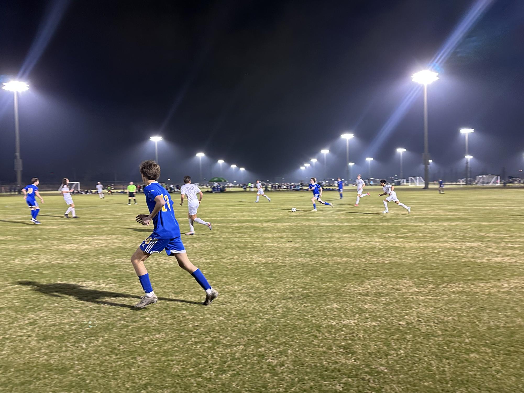 Kick off… Striker Tyler Lucas runs down the field opening up for the pass. Lucas received the ball and took a shot on goal. 