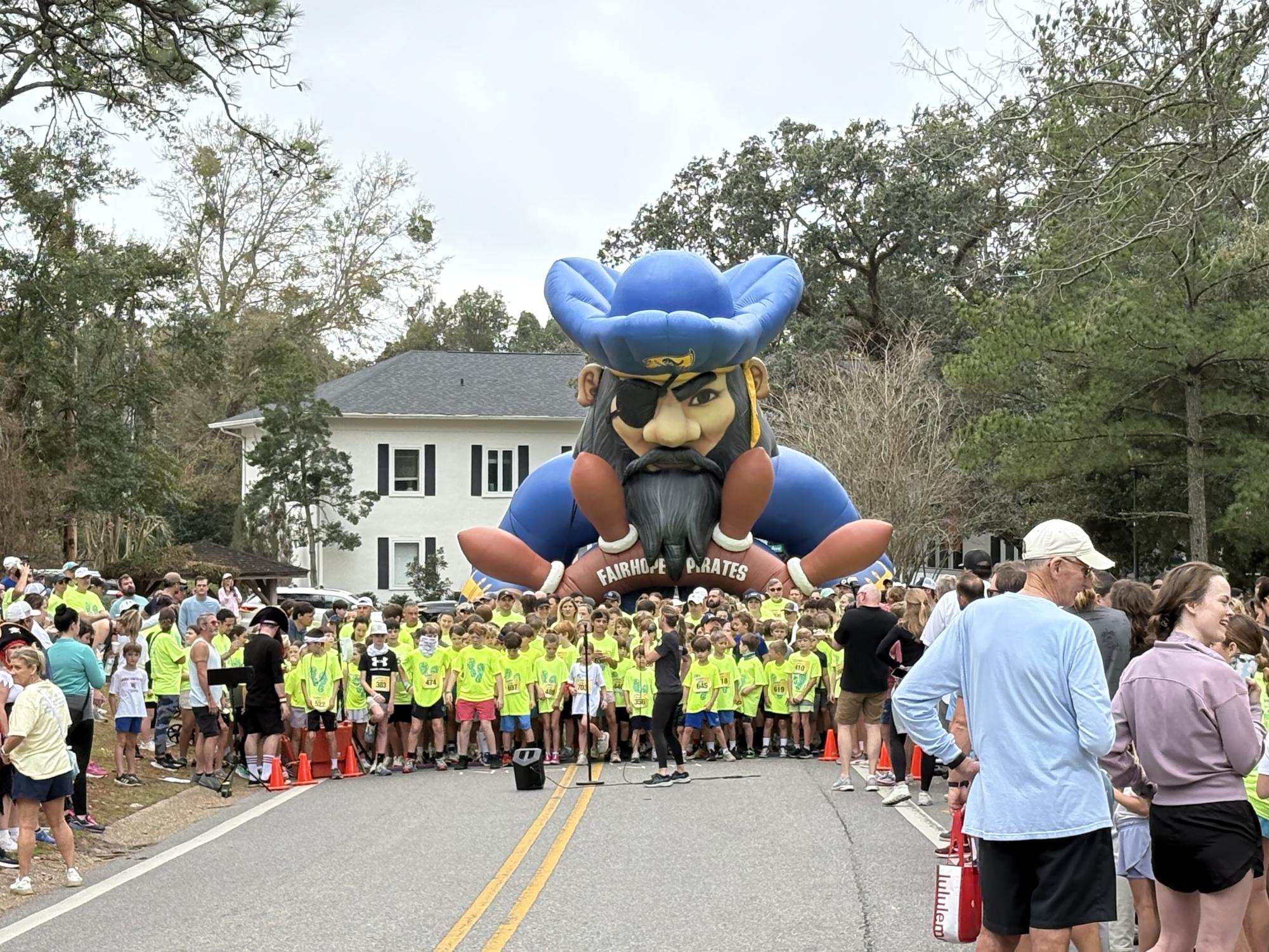 On your marks, get set, go!... The elementary school kids await the Pirate Dash in downtown Fairhope. The kids ran a one- mile dash to raise money for their schools. “My favorite part of the run is seeing all the kids running through the finish line,” Bruns said.