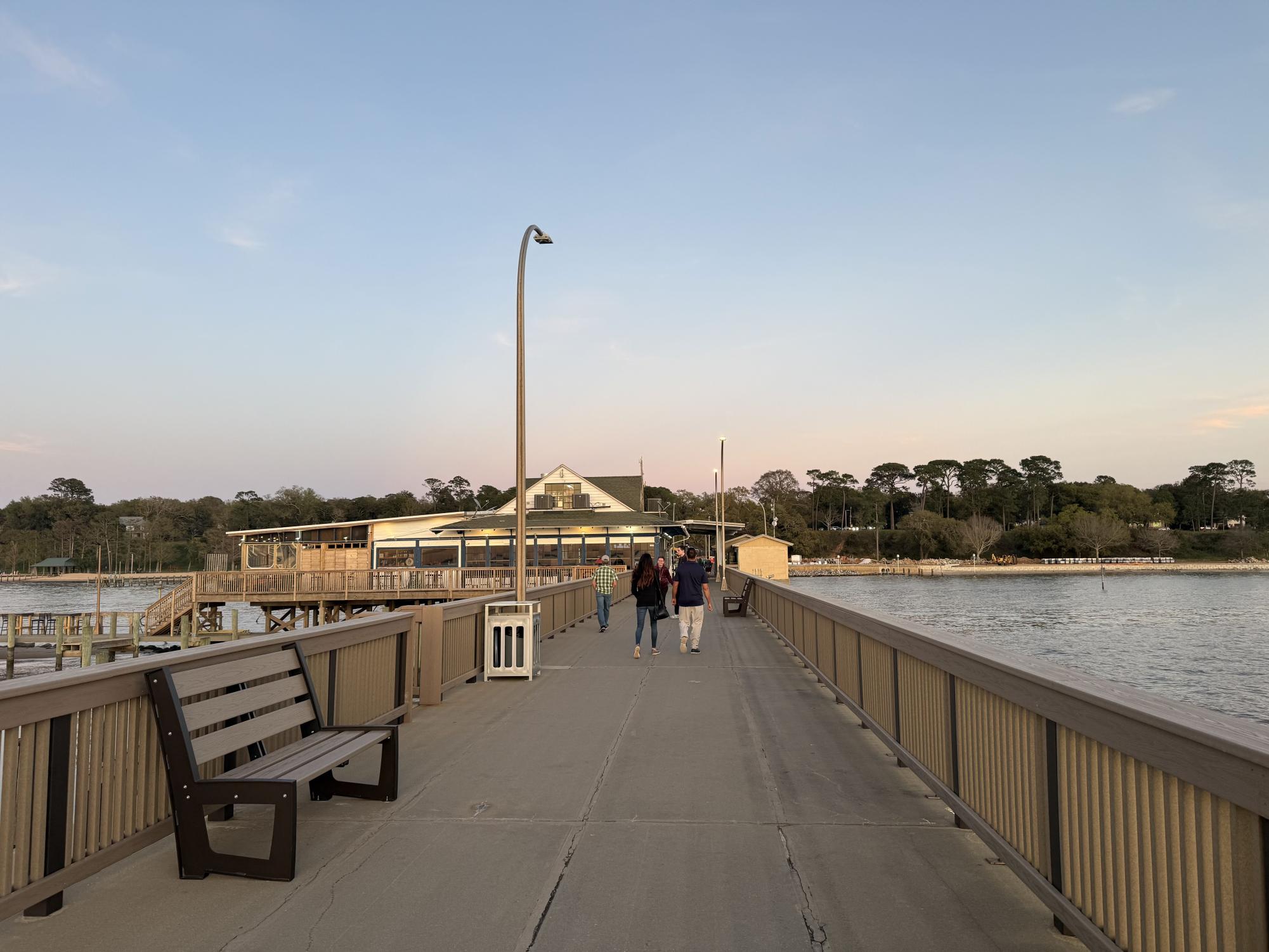 GOODNIGHT FAIRHOPE… Fairhope locals and visitors walk along the pier. They watched the sunset over Mobile Bay.