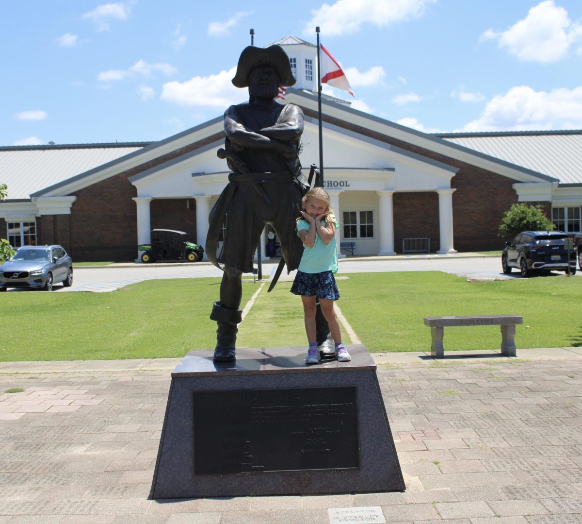Say cheese…  Journalism students take pictures of Pre-k students by Pete the Pirate earning a photo to their memories at Fairhope High School. Pre-K student Margaret Marcinko smiled big next to Pete.“The purpose of these pictures is to help the students remember the fun times we had together this year in Pre-K,” said Christy Carson, Pre-K teacher. 
