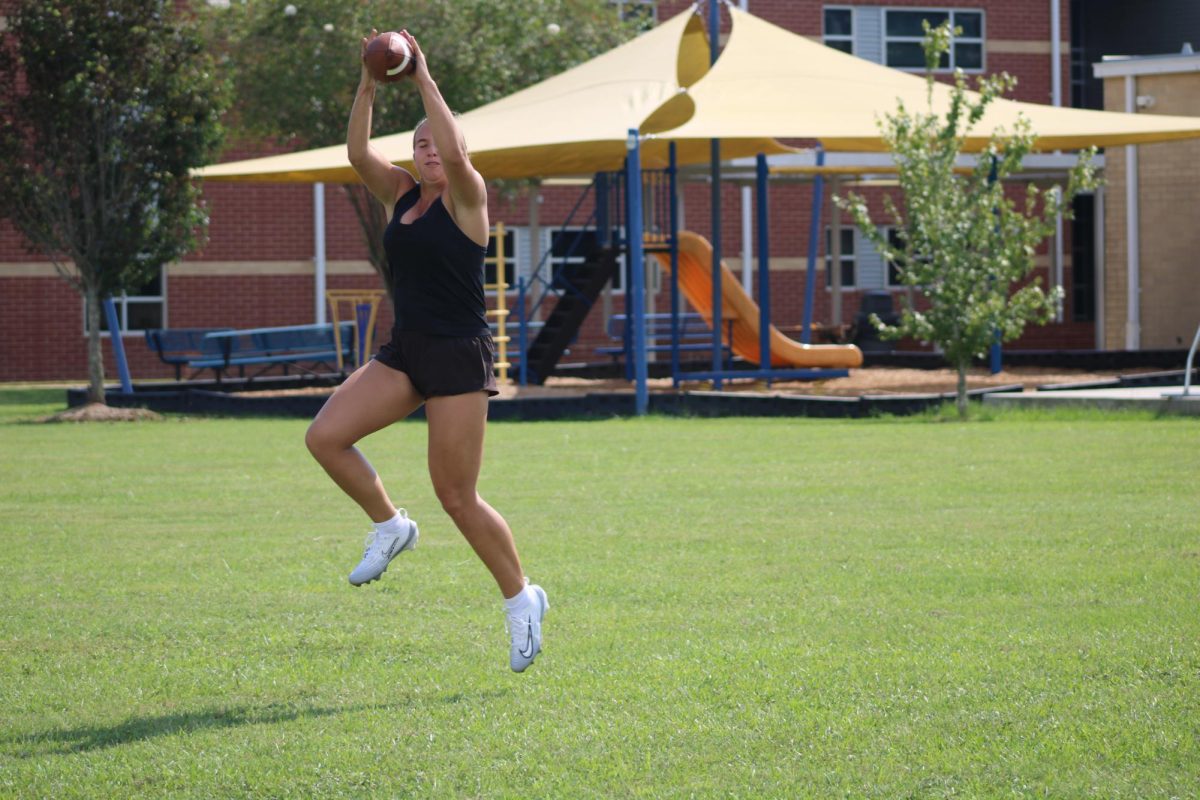 Practicing plays… Jordan receives the pass while practicing plays to defeat the Toros this Tuesday, August 26. The team rotated between conditioning and drills. 
