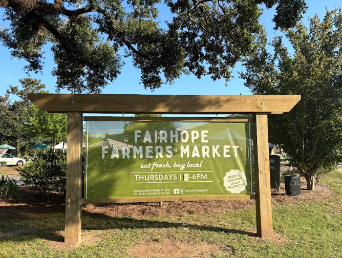 Welcome to the market… The Fairhope Outdoor Farmers Market promotes a welcoming environment with a friendly sign at the entrance. Locals flocked in to get delicious farm-fresh foods and goods. 
