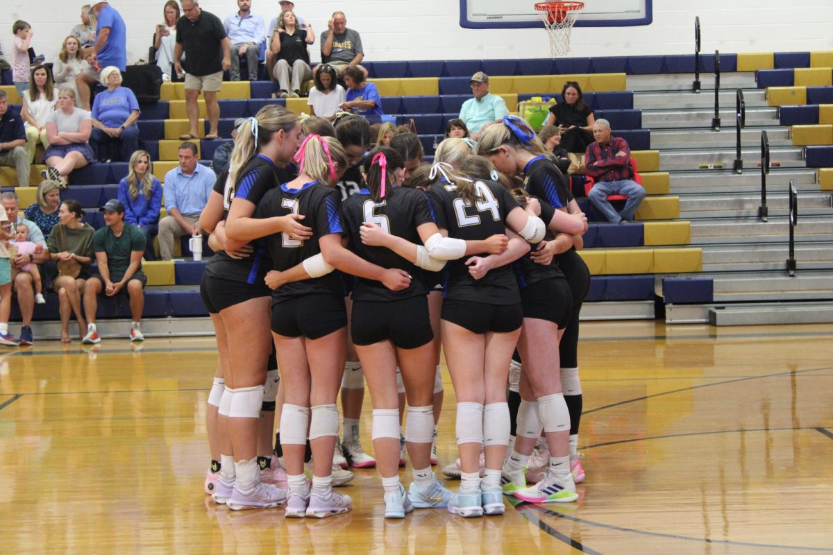 PIRATES ON 3… The Fairhope Lady Pirates huddle and share words of encouragement to each other. 