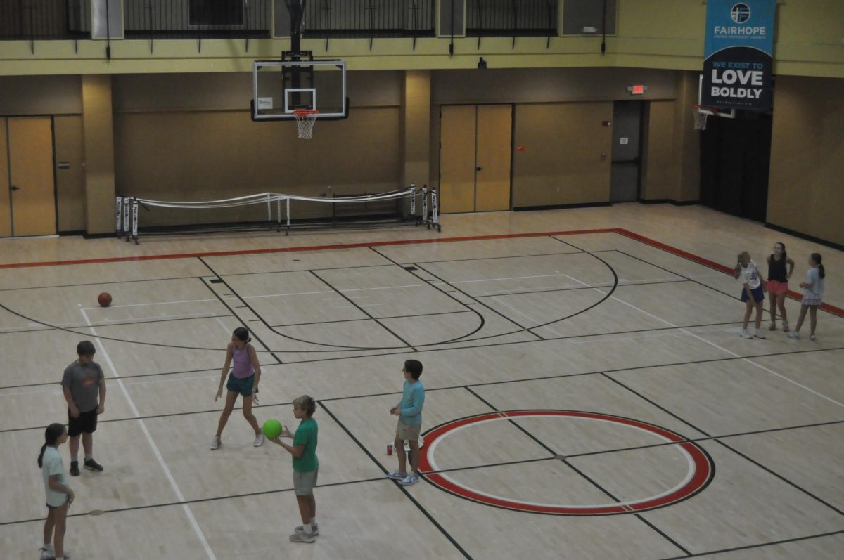 Final Hurrah...Kids waiting on rides home finish the night with four square. Once every kid, teenager and leader had left, children’s minister Jenna Hood turned off the lights and locked up the church. The Methodist Youth Fellowship meets every Wednesday at 7 p.m., in the Fellowship Hall.

