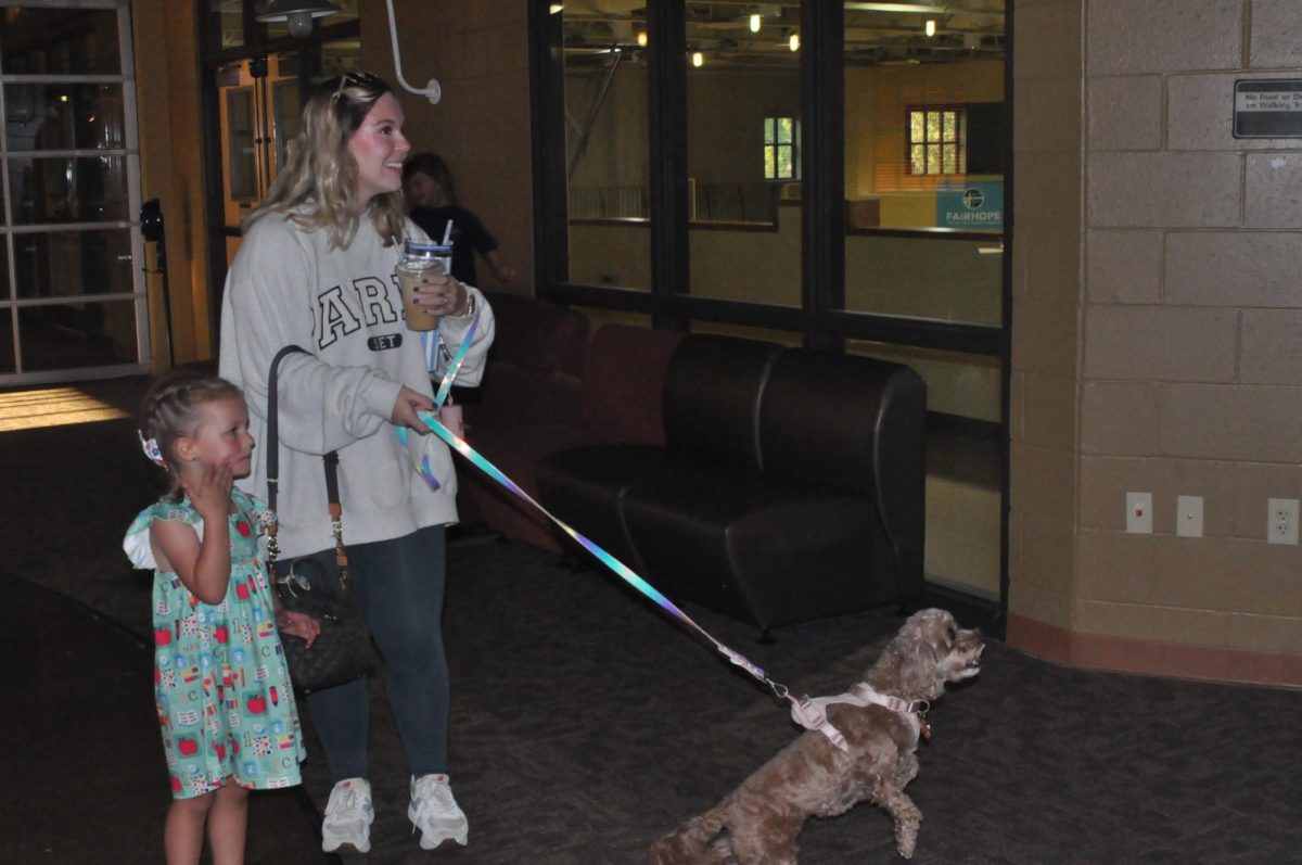  Puppy... Small group leader Sidney Carol Barnheart welcomes everyone to church with her puppy, Buttercup. Buttercup welcomed everyone with a wagging tail and puppy kisses.