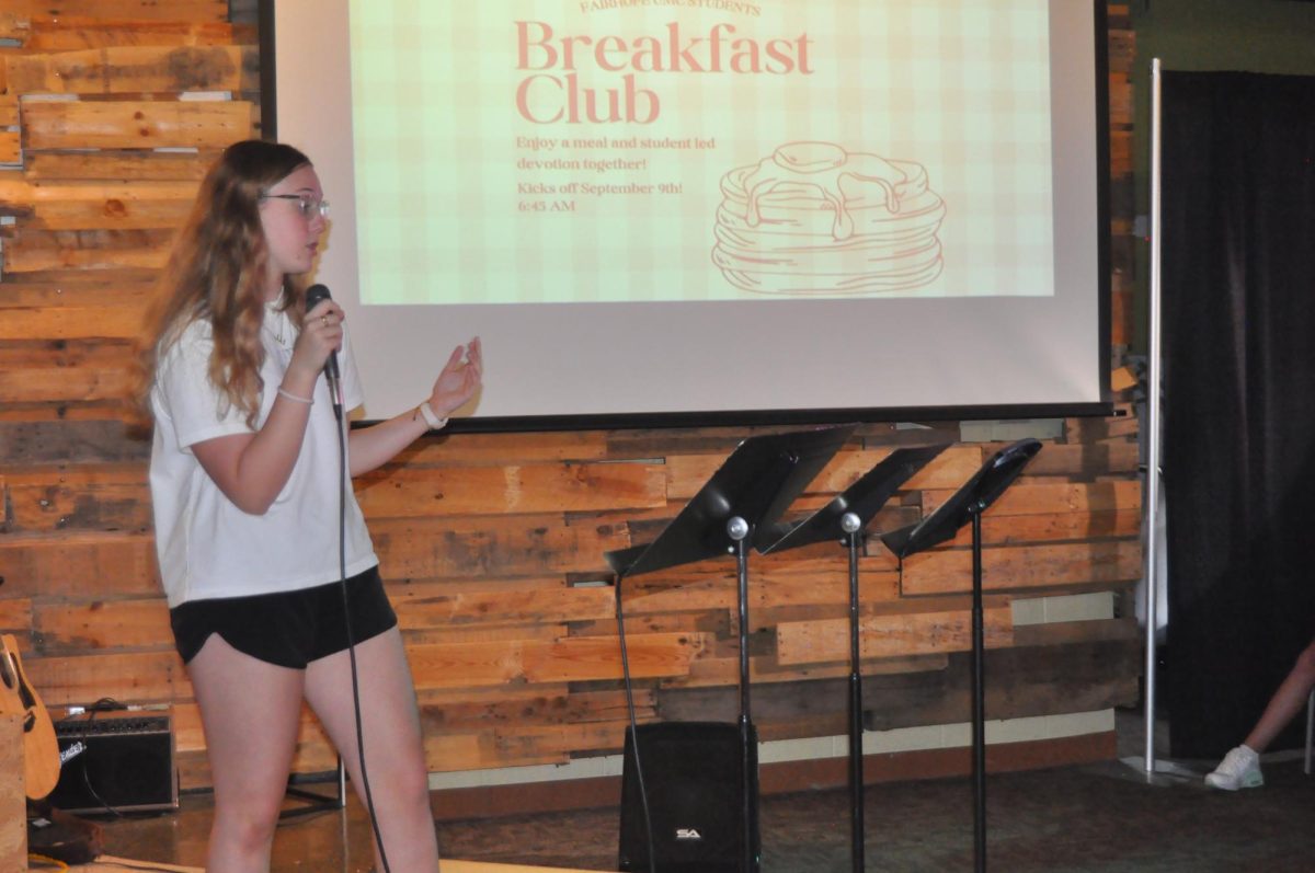  Announcement time... Junior Emery Capstraw leads announcements before worship. Capstraw announced the upcoming Discovery Weekend, Tuesday brunch Bible studies and Sunday night worship.