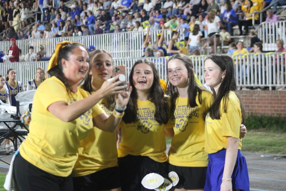 Ready, smile… Athletic trainer Marlee Carnevale takes a selfie with student trainers  Madison Burts, Camille Peacock, Emmalynn Horne and her sister Katelynn Horne before the game. The trainers wore Spina Bifida t-shirts to show their awareness. 