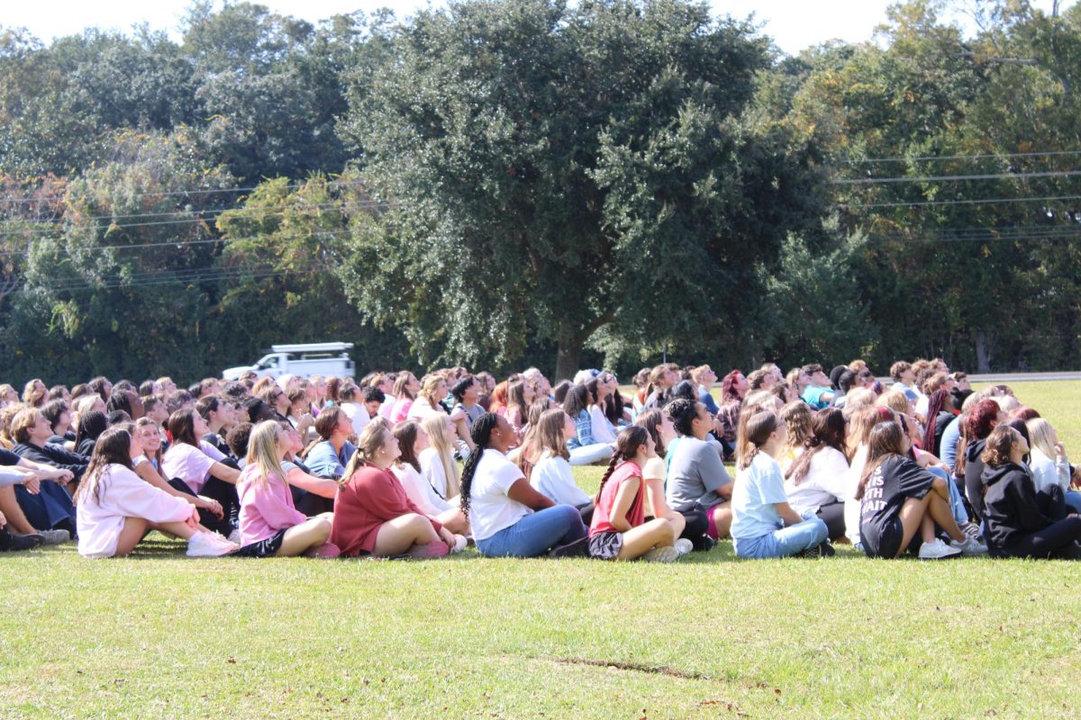 Say cheese…Any senior who is willing to participate in the 26 year photo is allowed to participate. “It is a tradition like no other,” Coleman said. (Halle Smith)
