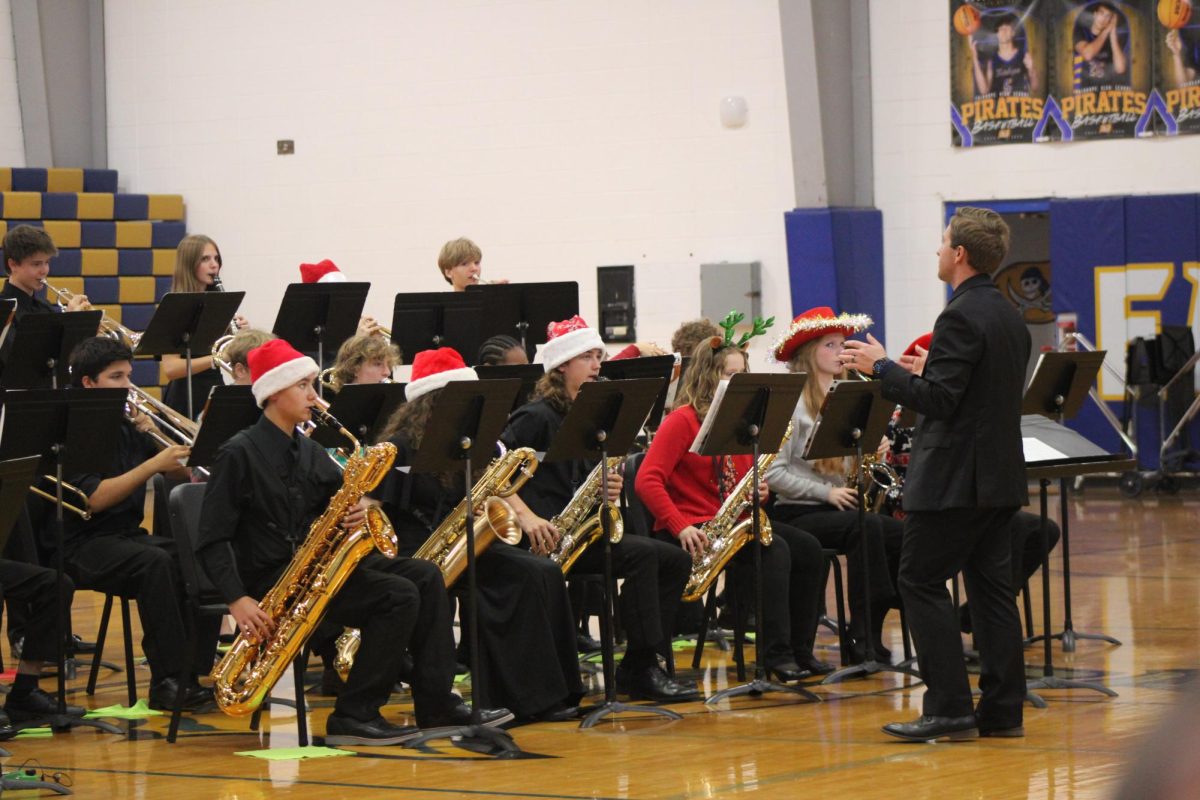Jazz and jingle bells… The FHS Jazz band warms up for their fine arts night performance. The band later performed the famous jazz song “Birdfall.” (Riley Wootten)