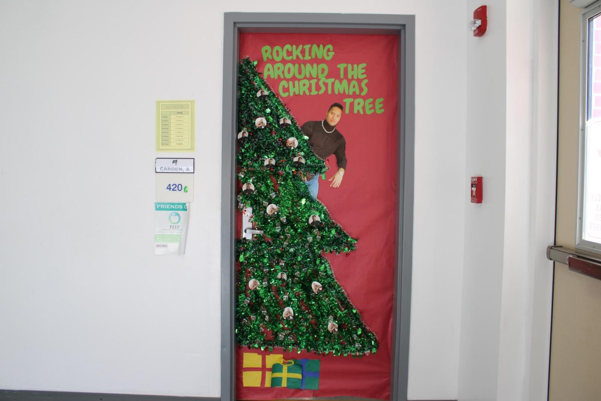 Funniest Door- History Teacher Andrew Carden wins the Funniest Door award with his Kevin Hart and  The Rock door decorations. (Halle Smith)