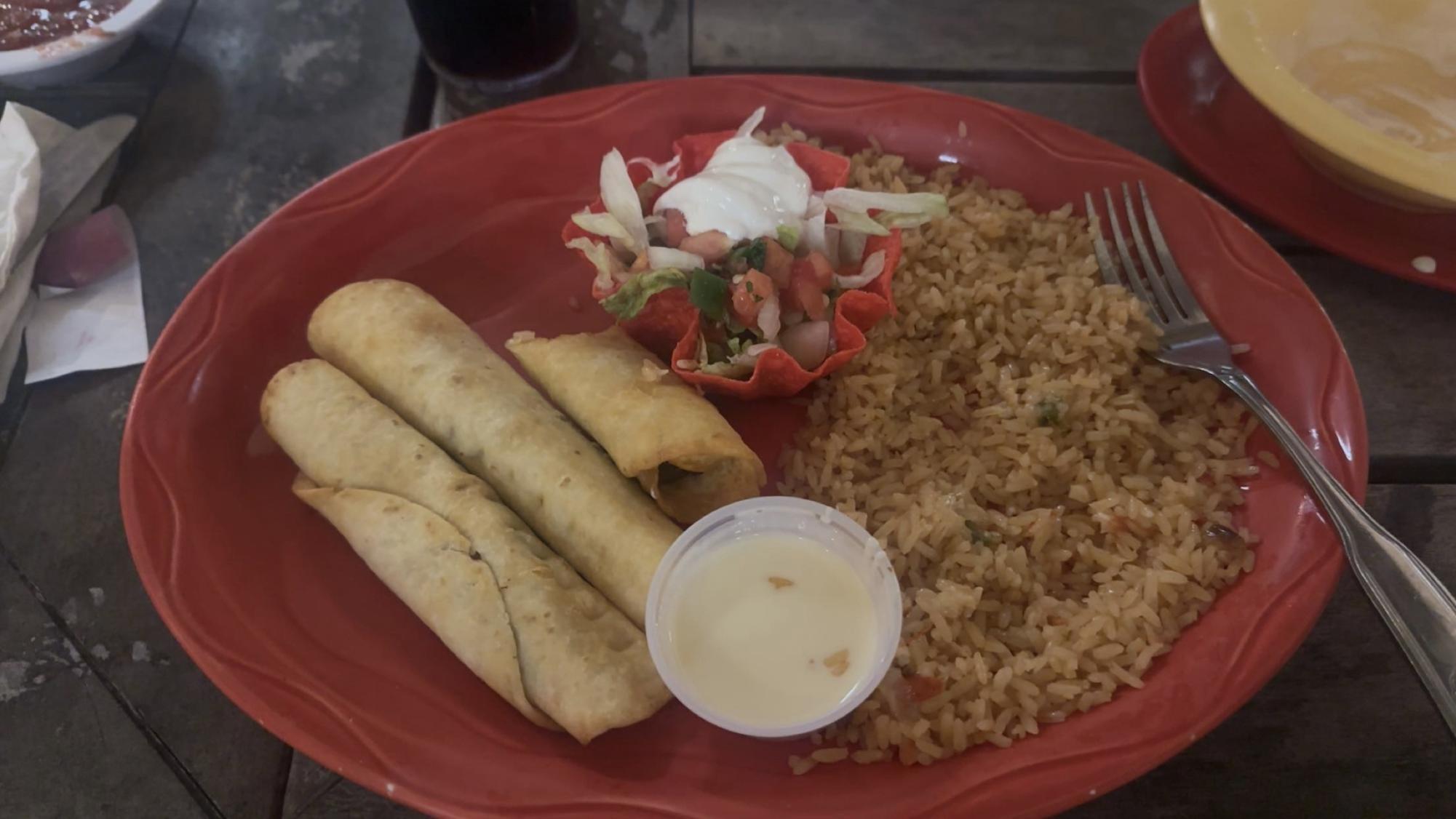  Fried up goodness…The smell of fried tortillas and cheese dip made every mouth at the table water. The dish came with three flour tortillas and a choice of either beef, shredded chicken, or carnitas inside them. (Audrey Parsons). 
