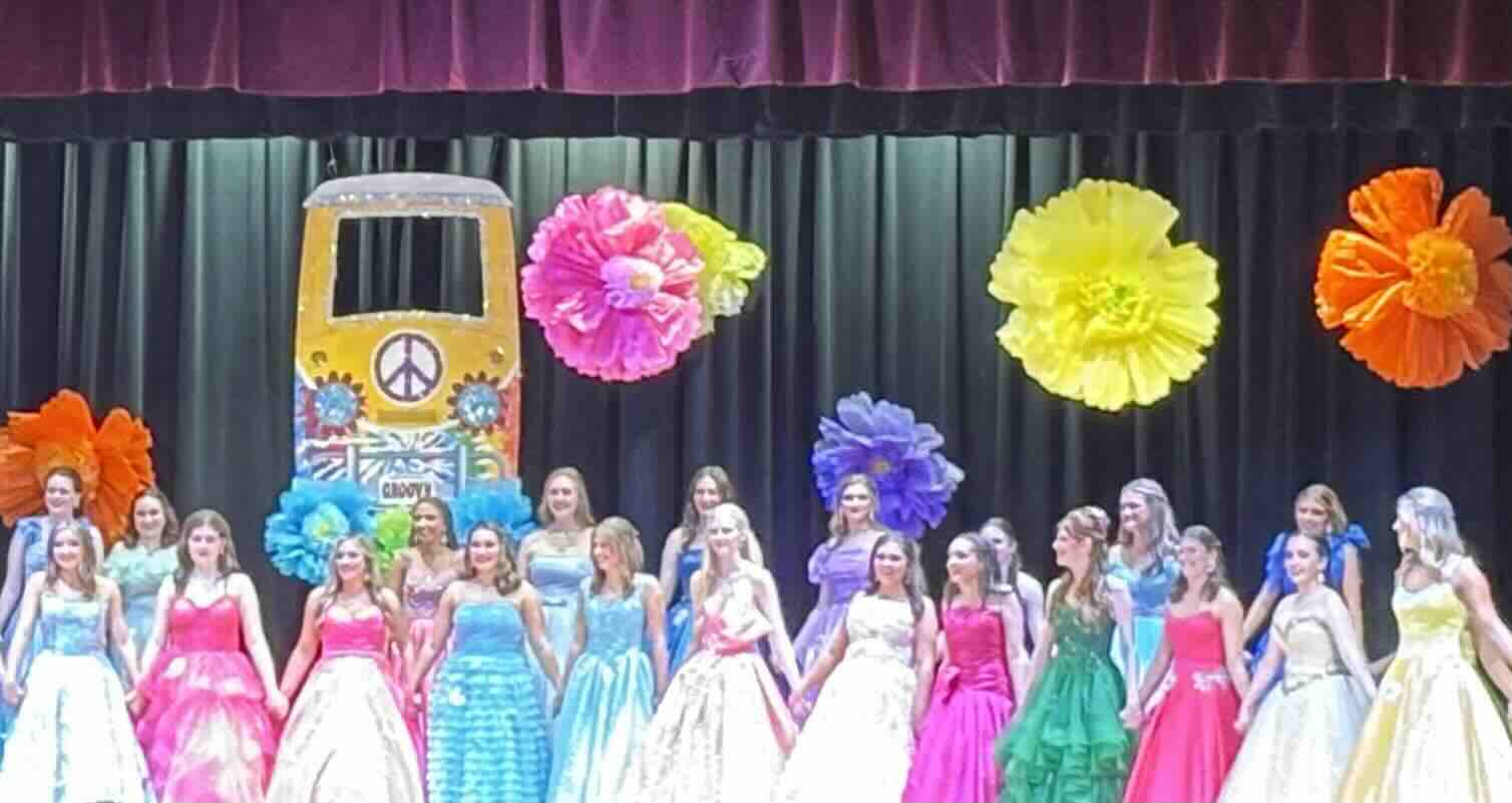 Filled with flower power… The contestants line up across the stage awaiting the final fourteen to be announced. (Lucy McIntosh) 