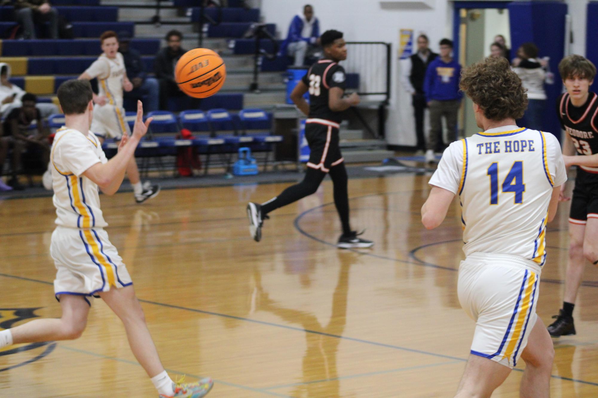 Blind ball…Senior guard Reece Olmstead passes the ball to senior guard Alex Markris to relieve pressure and trick the opposing team. Olmstead performed a blind pass with the ball and looked in the opposite direction as he passed the ball to his teammate. 