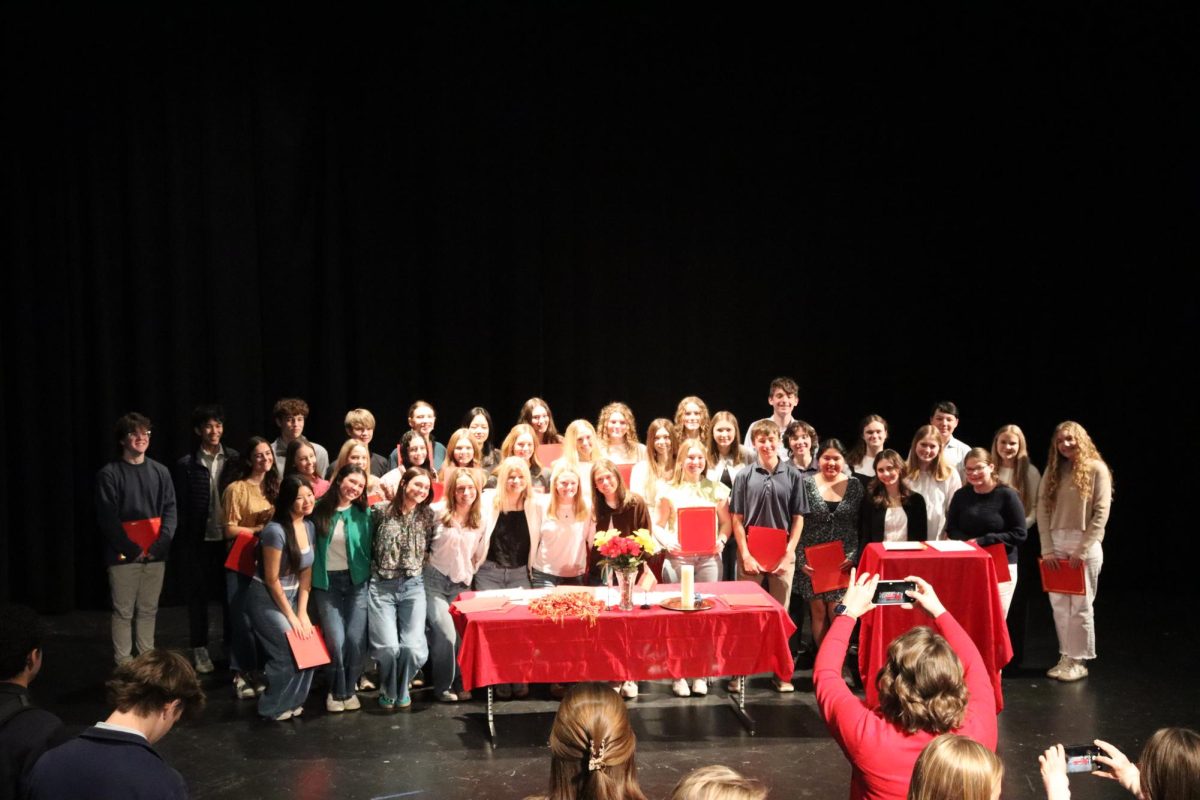 Smile everyone…Juniors hold up certificates for a photo. Afterward, they took another group photo with seniors. (Briar Garner)