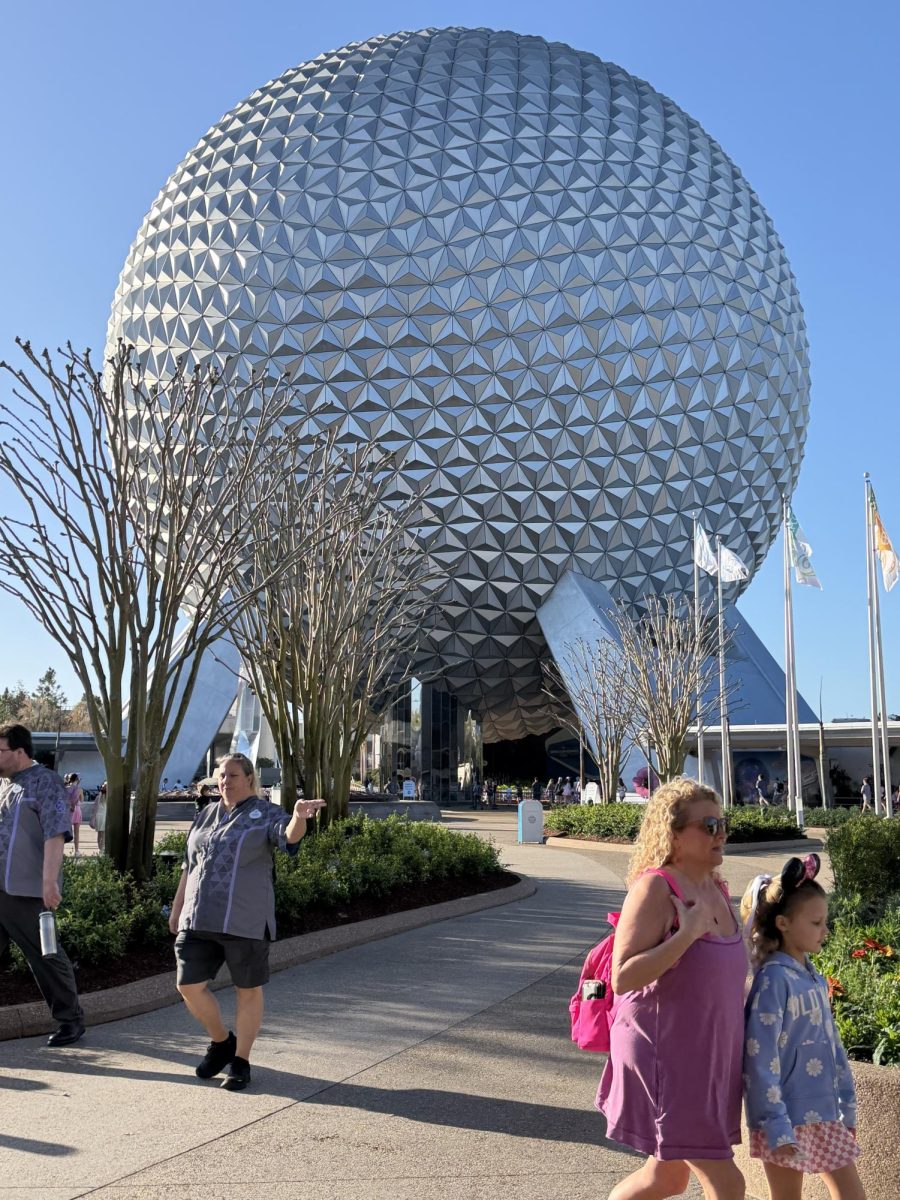 Main Icon… The EPCOT Ball, also known as Spaceship Earth, rises high above the rest of the park attractions. Fairhope High School Journalism teacher Angela Garner walked with her granddaughter in front of the attraction.