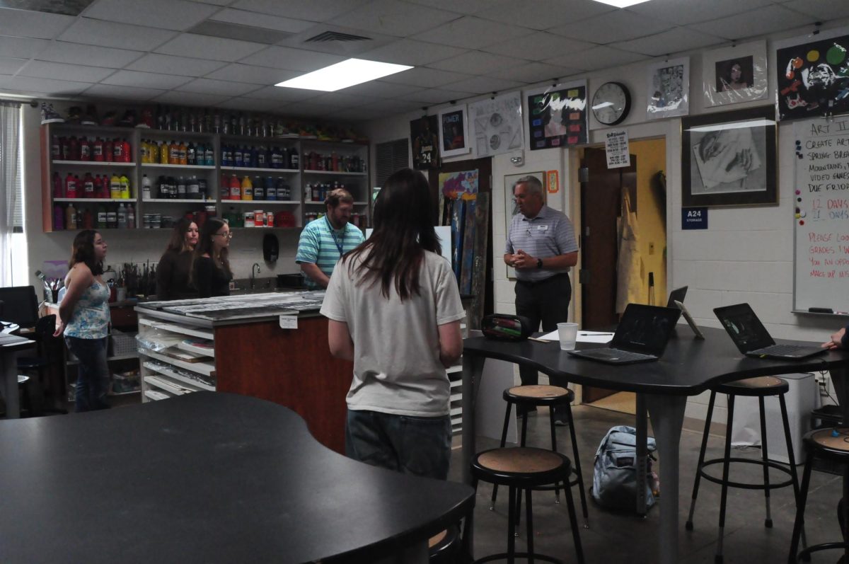 Celebrating creativity… Jim Bates delivers an encouraging speech to the grant recipients during art class. 