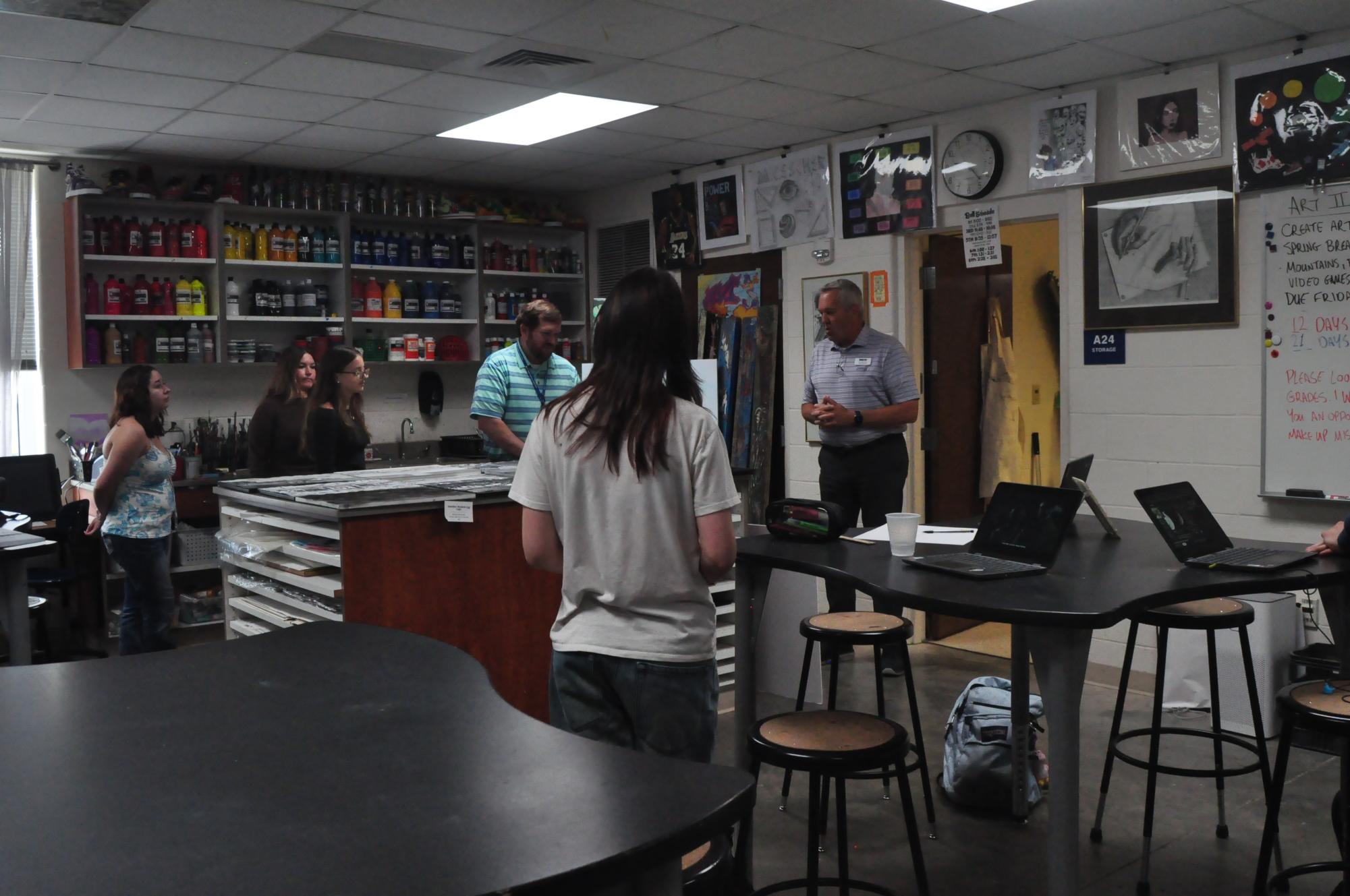 Celebrating creativity… Jim Bates delivers an encouraging speech to the grant recipients during art class. 