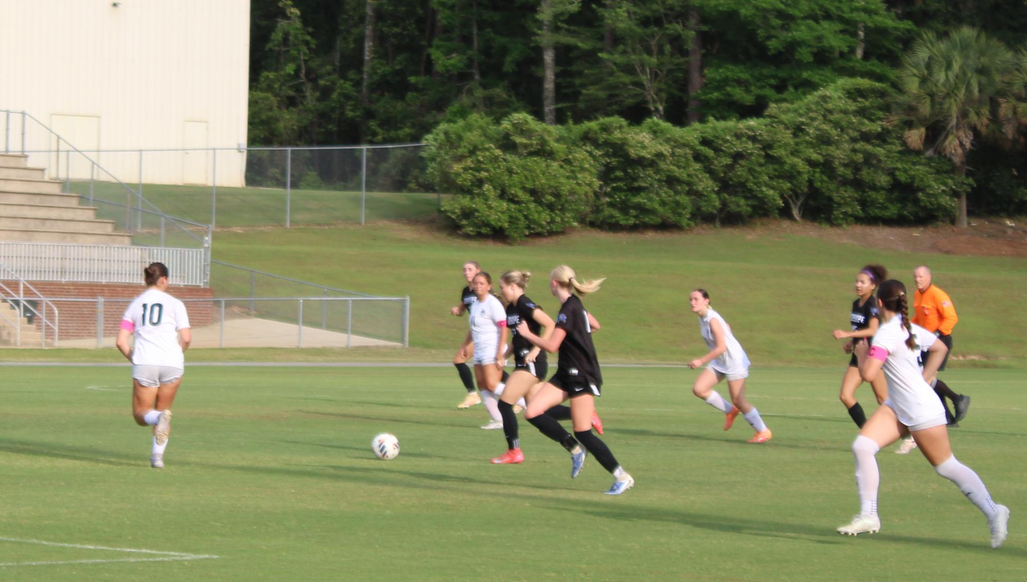 Driving to victory…. Sophomore Brooklynn Guerry dribbles down the field. Guerry passed the ball for a shot on the Hornets goal. (Abigail Robinson) 
