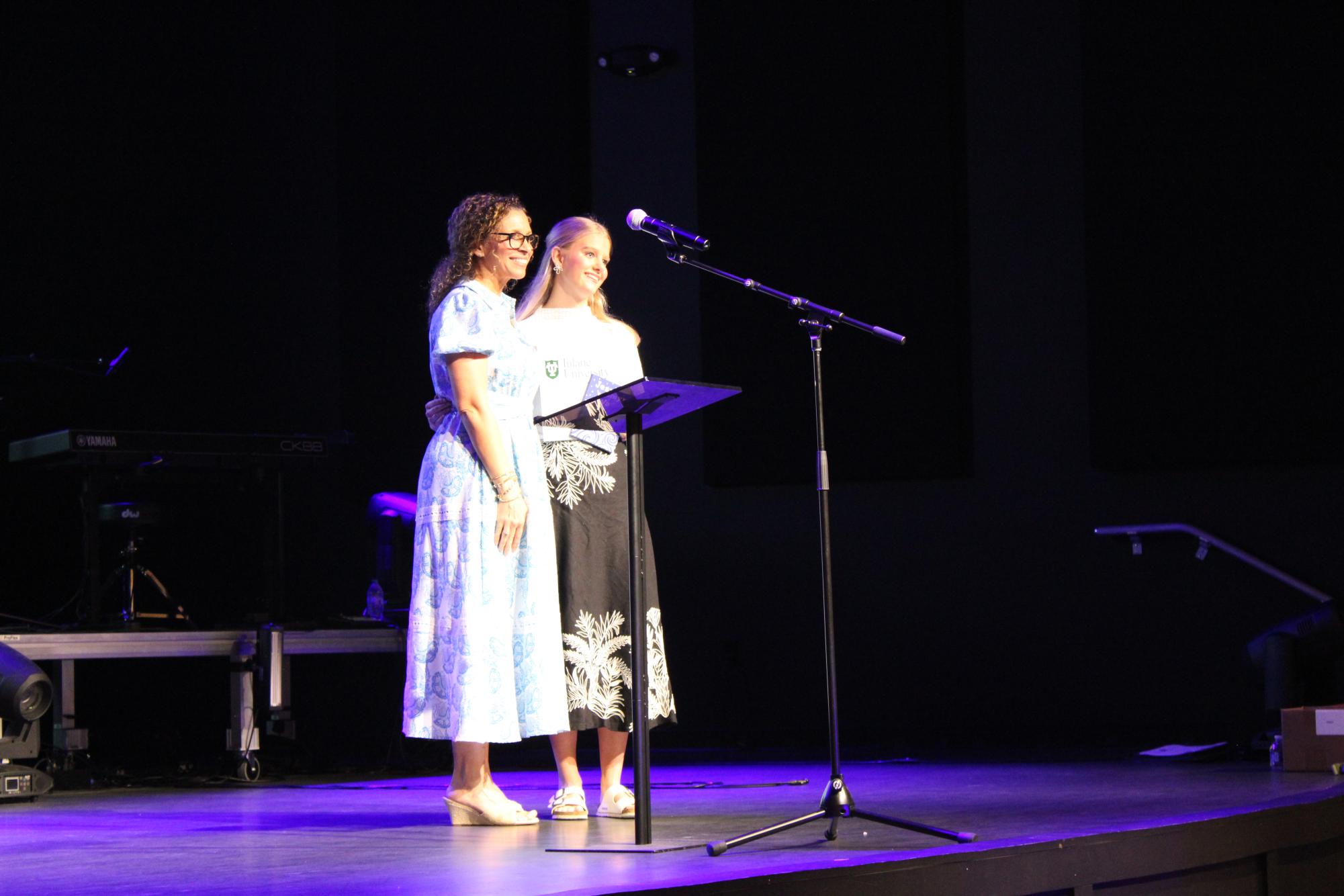 Hold your award and smile… Counselor Cammie Adams presents The Tulane Book Award to Junior Jean Pearson. Adams, who submitted her nomination, congratulated Pearson for her achievement.