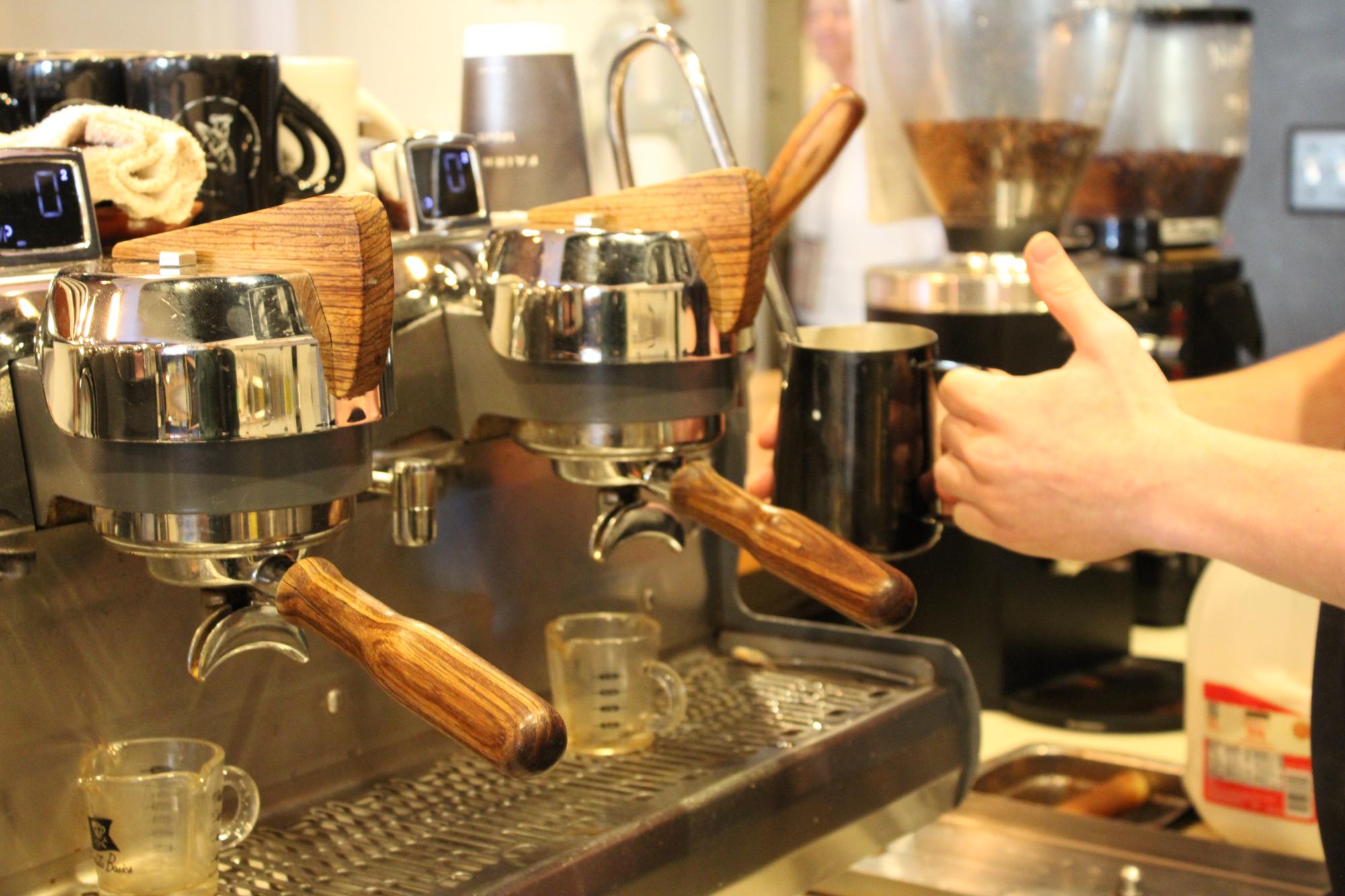 Steaming hot…Bond steams milk into froth for a latte. Most of the baristas at the refuge make a swan using frothed milk.